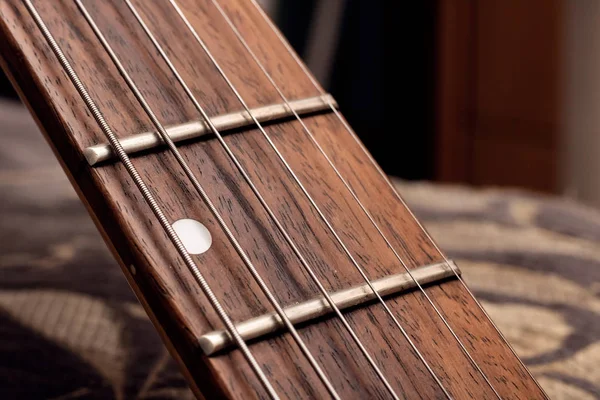 Wooden fingerboard of the guitar and strings close up — Stock Photo, Image