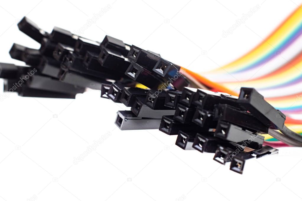 Thin multicolored wires with connectors, arduino wire on white background
