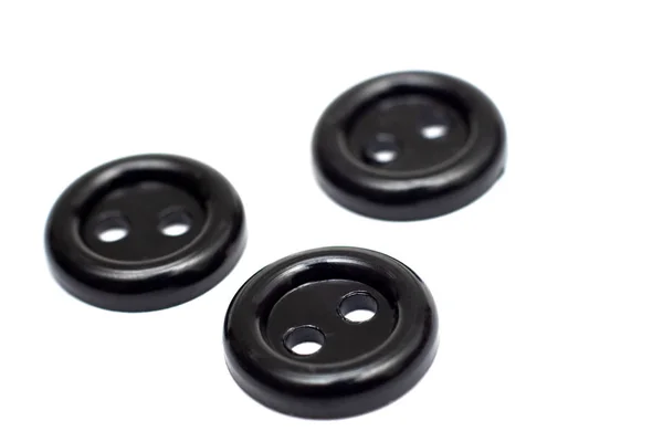 Τρία Μαύρα Πλαστικά Κουμπιά Απομονωθεί Λευκό Φόντο Εσωτερικη — Φωτογραφία Αρχείου