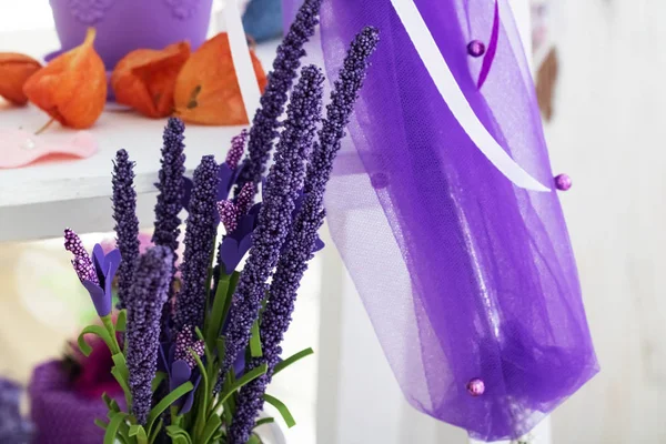 Bouquet of long purple flowers in the house close up