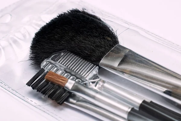 Brush for applying blush, makeup accessories on a white background