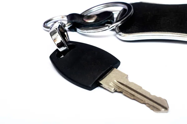 Key and black keychain, isolated on white background — Stock Photo, Image