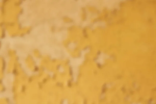 Vecchia vernice gialla sul muro, sfondo sfocato — Foto Stock
