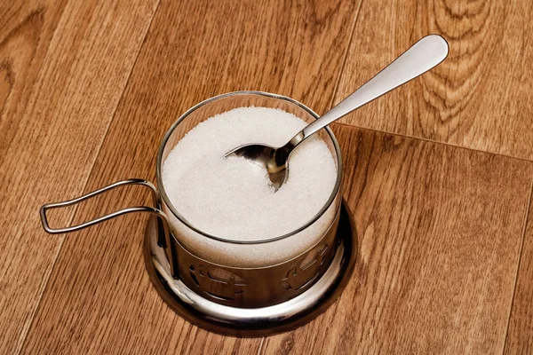 Sugar bowl closeup isolated on a wooden table — Stock Photo, Image
