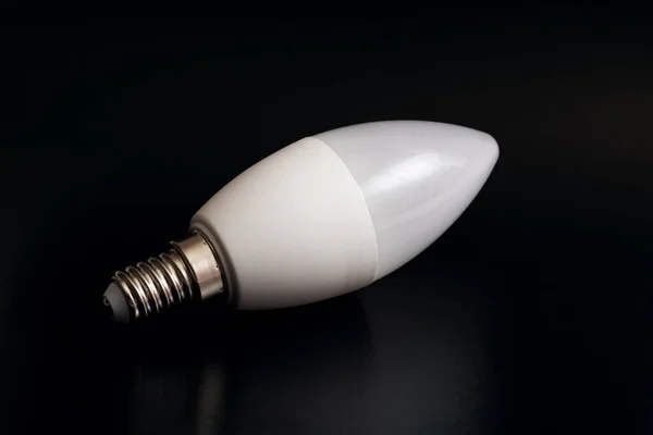 White LED light bulb on a black background — Stock Photo, Image