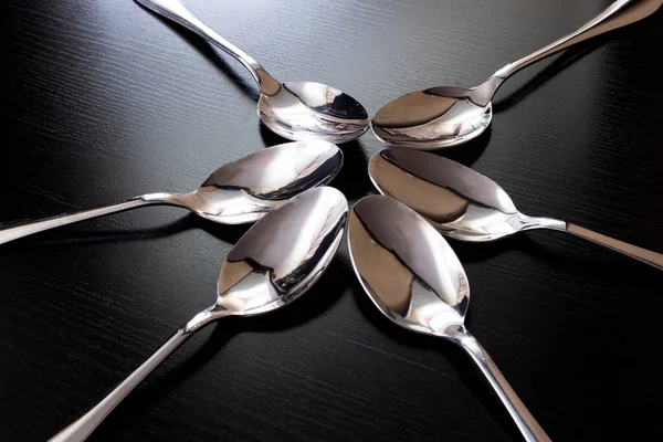 Many Spoons Black Wooden Table Close — Stock Photo, Image