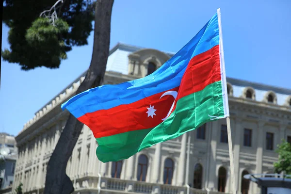 Azerbaijan flag in Baku, Azerbaijan. National sign background. Red Green Blue flag. Azerbaijan national flag with Crescent moon. Azerbaijan tradition patriotic. Flags waving wind