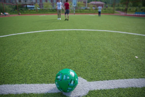 Football defocused players penalty on field Small, Futsal ball field in the gym indoor, Soccer sport field . Corner of a soccer field . Mini Football Goal On An Artificial Grass .