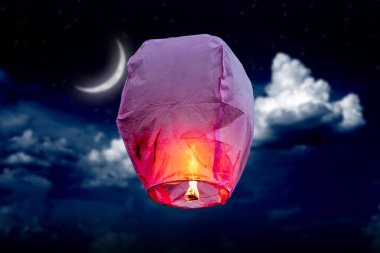 balloon fire flying lanterns, hot-air balloons Lantern flies up highly in the sky. Moon backgrounds clipart