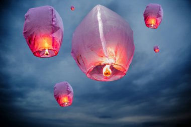 balloon fire flying lanterns, hot-air balloons Lantern flies up highly in the sky. clipart