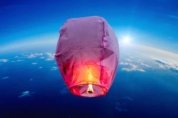 balloon fire flying lanterns, hot-air balloons Lantern flies up highly in the sky.