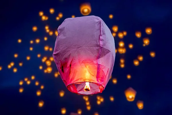 balloon fire flying lanterns, hot-air balloons Lantern flies up highly in the sky.