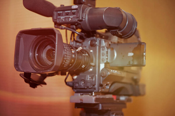 Video camera lens - recording show in TV studio - focus on camera aperture