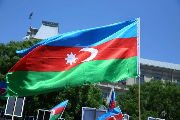 Azerbaijan flag in Baku, Azerbaijan. National sign background. Red Green Blue flag. Azerbaijan national flag with Crescent moon. Azerbaijan tradition patriotic. Flags waving wind