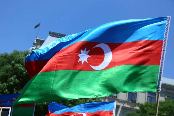 Azerbaijan flag in Baku, Azerbaijan. National sign background. Red Green Blue flag. Azerbaijan national flag with Crescent moon. Azerbaijan tradition patriotic. Flags waving wind