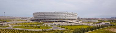 Bir 650.000 metrekare sitesinde 225.000 metrekare stadyumun inşaat Şubat 2015 yılında tamamlandı. Altı katlı 65,7 metre yapısı yakın Boyukshor göl, Bakü, Azerbaycan