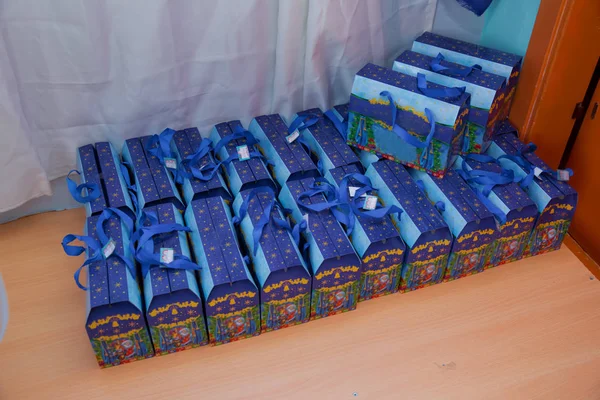 Christmas New Year gifts. Blue New Year Boxes . Set of present boxes on New Year celebrations concept . Christmas gifts on shelves of candy store . Christmas blue gift Boxes .