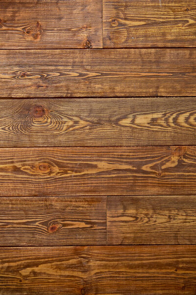 Wood Material Background Wallpaper Texture Concept .Old brown board in warm colors. Dark old wooden table texture background top view . vertical wooden background .