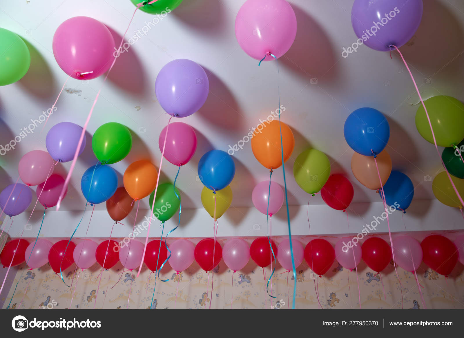 Colorfull Balloons Float On The White Ceiling In The Room