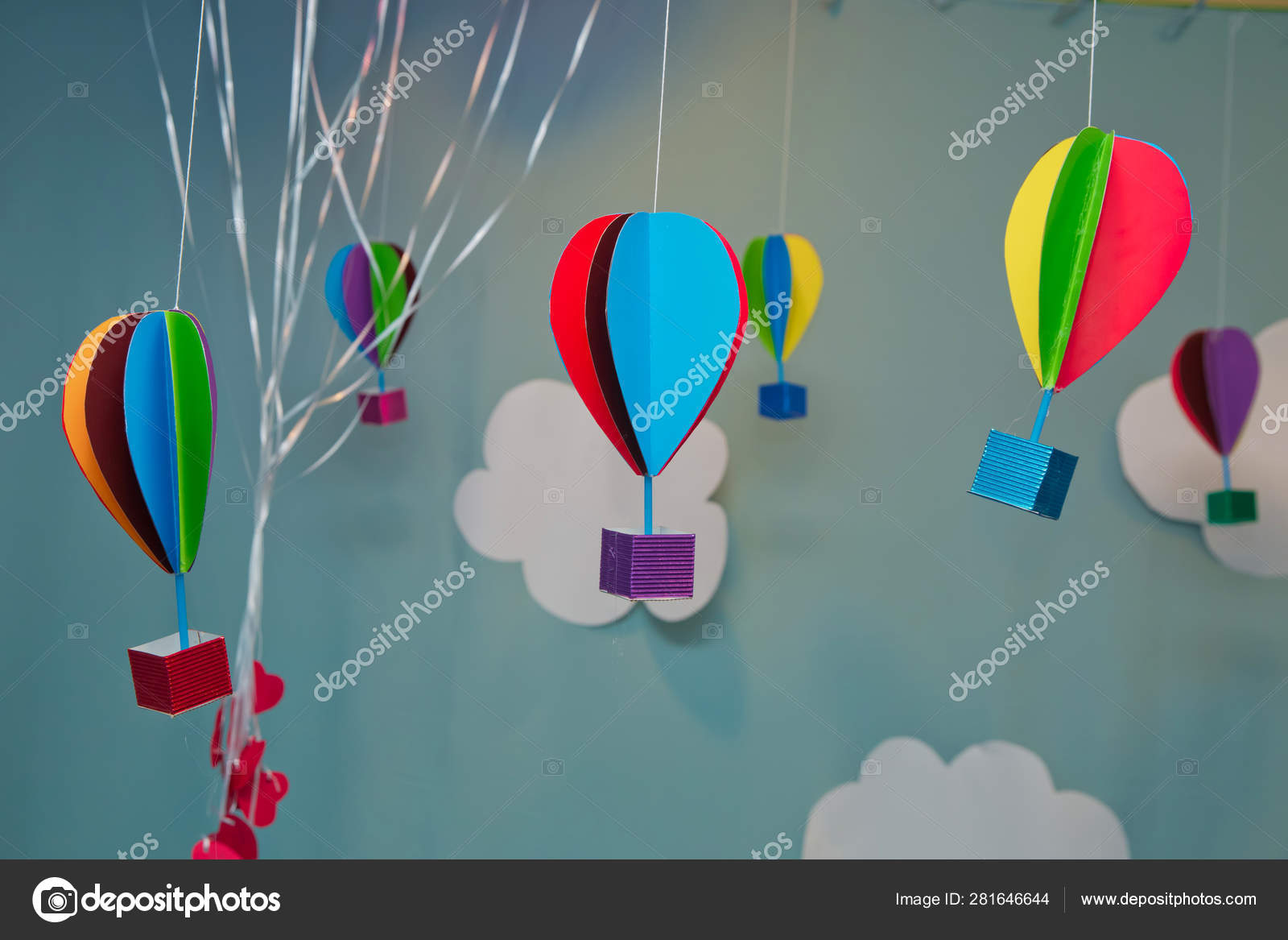 Hanging From Above Colorful Paper Balloon With Blue Sky Background