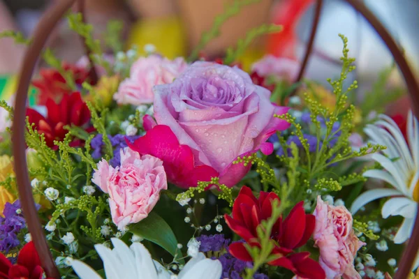 Purple, red flower picture close up in the bouquet.