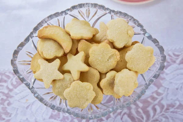 Plate with Christmas star cookies, sweet snack for kids, food for holidays . Star biscuits inside the plate.