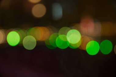 Gece ışığı. Bokeh arka plan, Blur kavramı. Soyut odaklanmış bulanık bokeh ışık nokta arka plan. Defocused Noel ışıkları arka plan. Soyut ışıklar. Odaklı olmayan ışık arka planı.