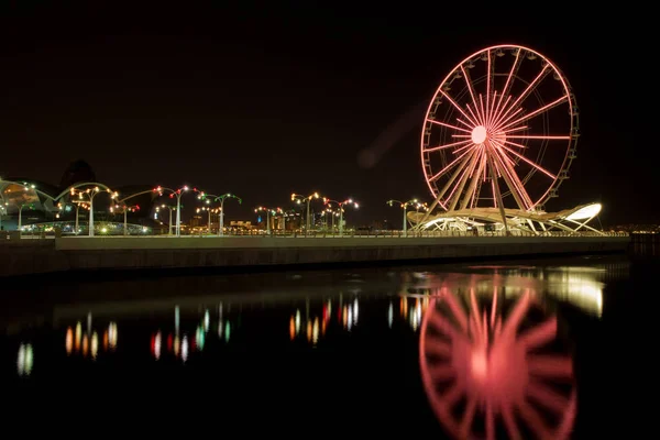 Attraction Ferris wheel installed on the embankment of Baku seaside Boulevard for the entertainment of tourists.