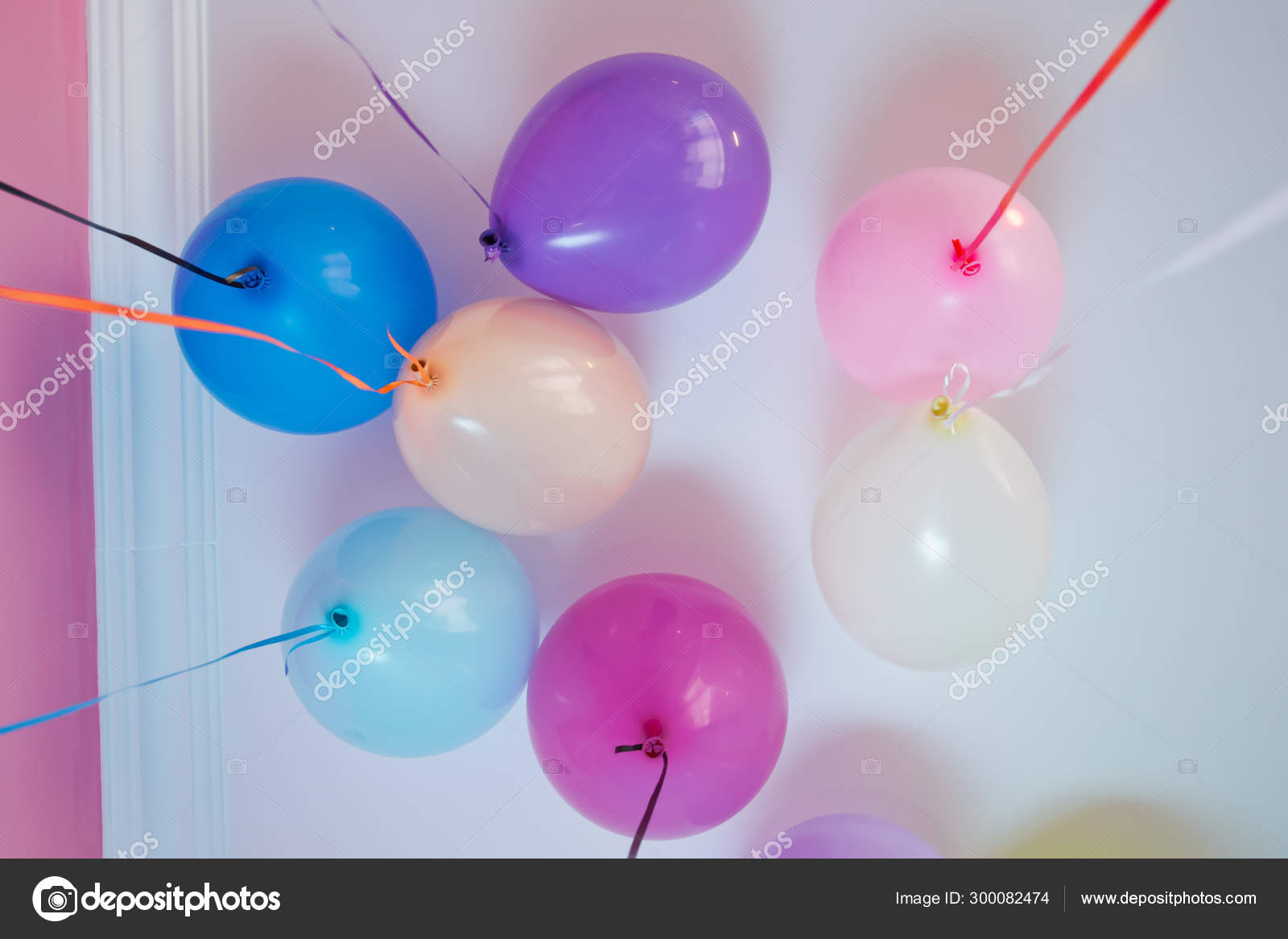 Colorfull Balloons Float On The White Ceiling In The Room