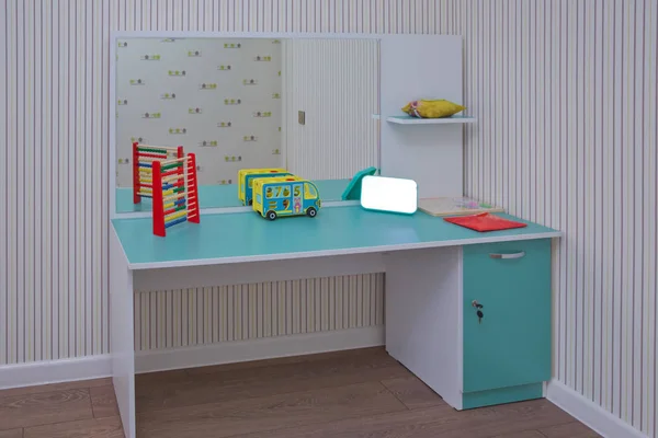 child development center room and desk . Kindergarten preschool classroom interior.