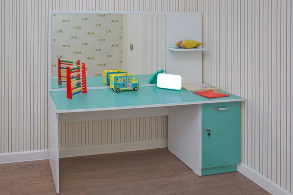 child development center room and desk . Kindergarten preschool classroom interior.