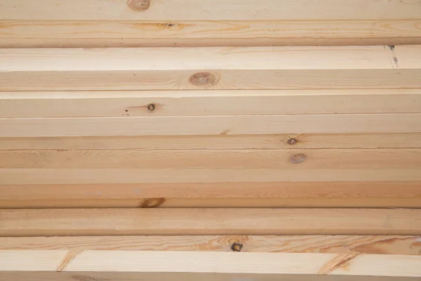 Hardware store, construction material for background and texture, Wood products, planks, lining, boards for construction works . Timber industry objects. Finished wood beams or plank at a warehouse. — Stock Image Hardware Store Construction Material Background Texture Wood Products Planks Lining Stock Photo