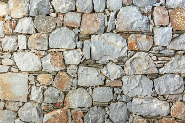 Cerca de parede de pedra textura rústica fundo close-up . — Fotografia de Stock