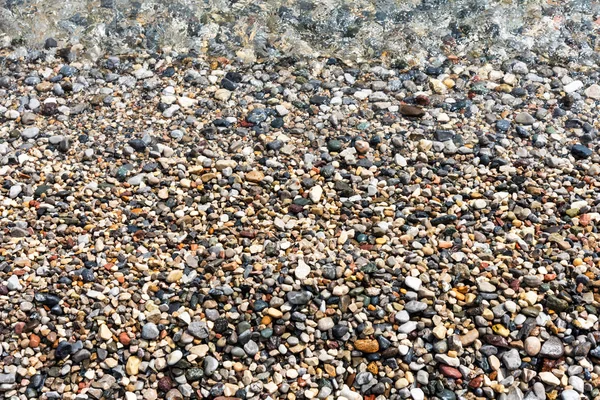 Fondo Diferentes Tamaños Colores Guijarros Mar Húmedo Piedras Agua — Foto de Stock