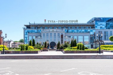 TULA, RUSSIA - MAY 19, 2019: View of the Wedding Palace and Monument to Tula Gingerbread, a bronze sculpture of Tule symbol clipart