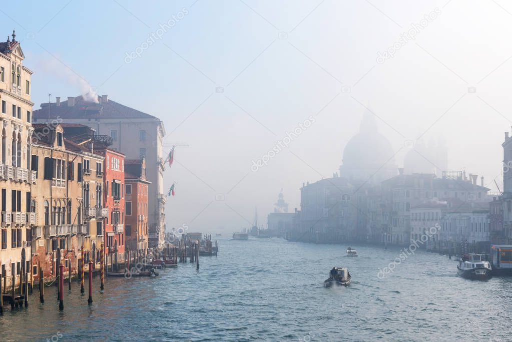 Grand Canal and Basilica Santa Maria della Salute in the winter fog, Venice Italy.