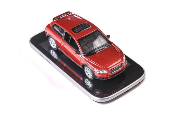 Красный Автомобиль Игрушки Смартфоне Изолированы Белом Фоне — стоковое фото