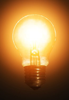 bir halo ışık koyu arka plan üzerinde parlayan ampul