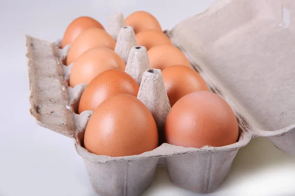 A box of chicken eggs. Closeup. Isolated.
