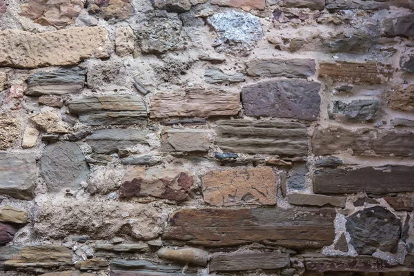 Steinmauer aus groben unbearbeiteten Steinen — Stockfoto