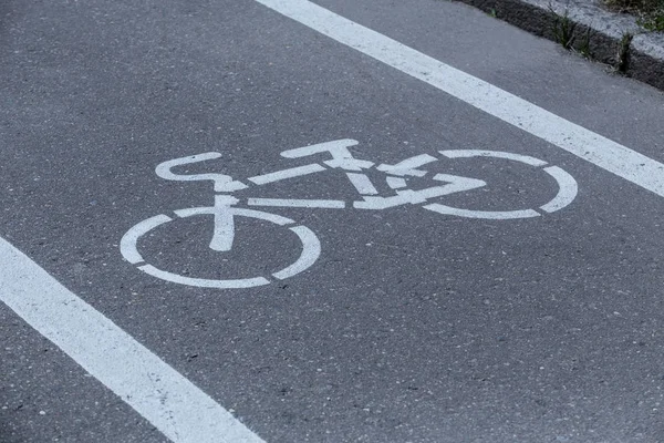 Bicycle path with a bicycle symbol on the asphalt — Stock Photo, Image