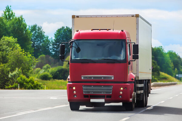 Truck semi-trailer moves along the highway 