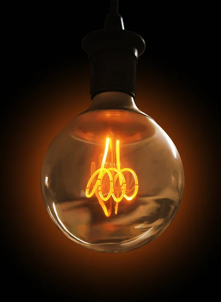 glowing light bulb on dark background