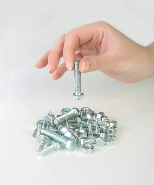 Metal Bolts Nuts Female Fingers Holding One Bolt White Background — Stock Photo, Image