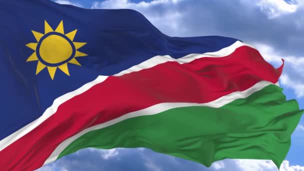 Флаг Размахивающий Ветром Против Голубого Неба Намибии — стоковое видео