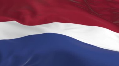 rüzgarda sallayarak bayrak ilmekledi bir arka plan olarak Hollanda