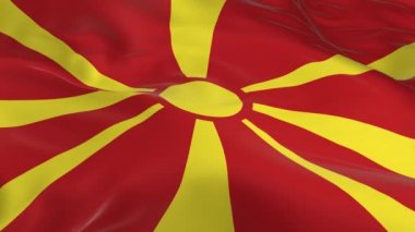 rüzgarda sallayarak bayrak ilmekledi bir arka plan olarak Makedonya