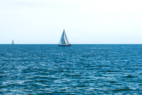 White boats in a blue calm sea