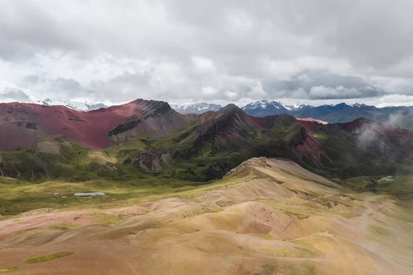 Famous mountains in Peru, Rainbow Mountains. Mountains of the color of the rainbow. Red mountains. Landscape in foggy weather