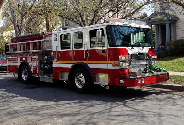 Fire truck on the scene of neighborhood medical emergency.